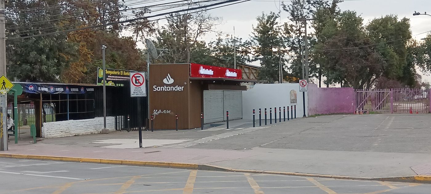 Corner branch of a Chilean bank in Santiago with signage and an entrance onto the street