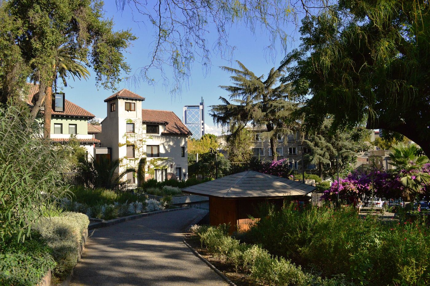 Leafy residential street with old houses in Barrio Bellavista, Santiago