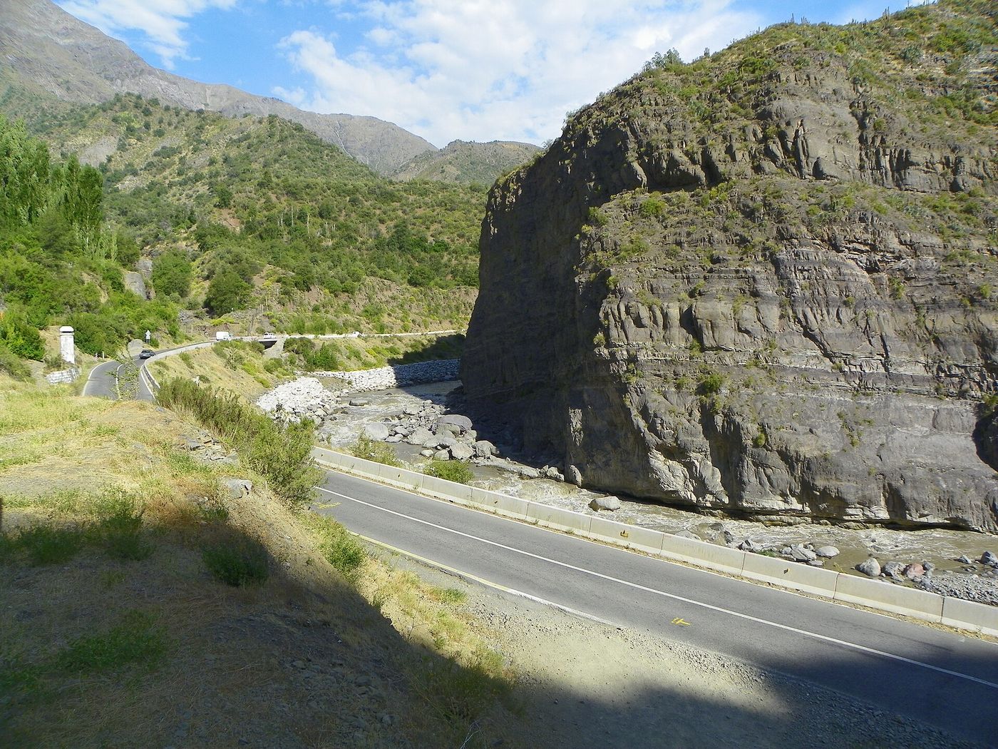 Road cut into the rock walls of the Cajon del Maipo canyon southeast of Santiago