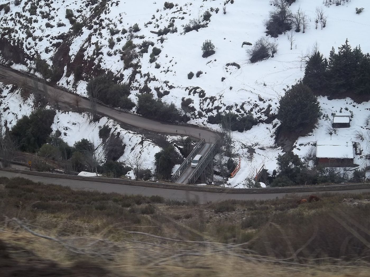 Snow-lined switchback section of the Camino a Farellones mountain road above Santiago, Chile