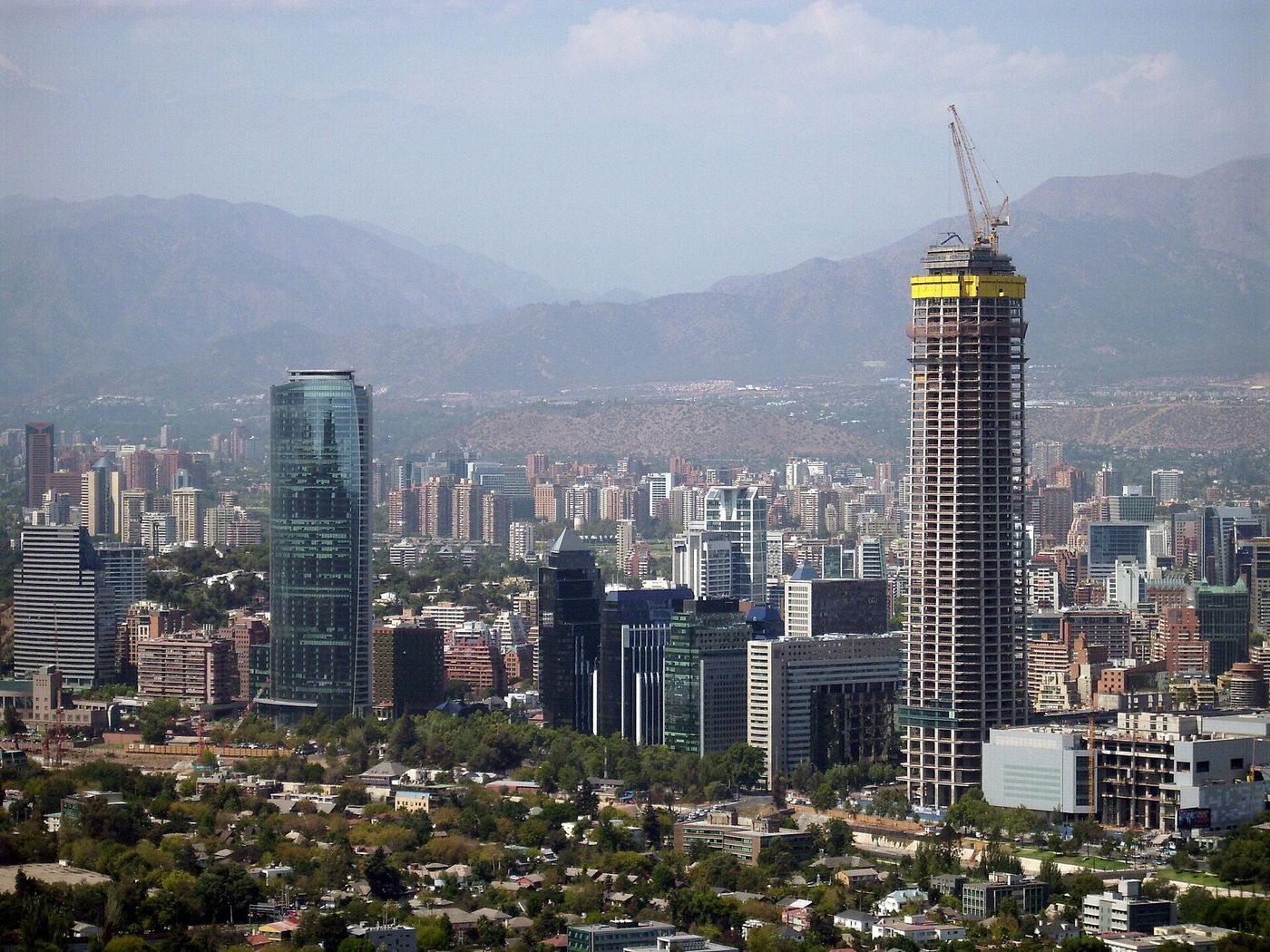 Gran Torre Santiago and the Costanera Center rising above the eastern Santiago skyline with the Andes behind