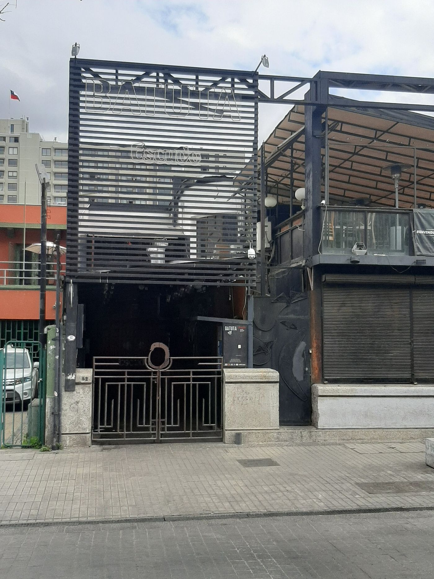 Dark metal-fronted entrance to La Batuta live music venue in Nunoa, Santiago