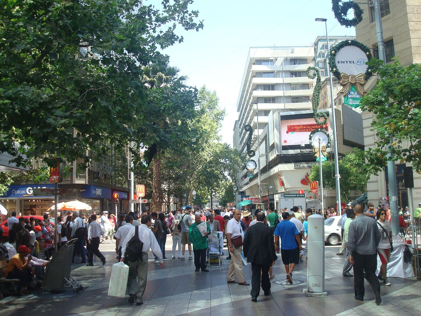 Shoppers walking along the busy Paseo Ahumada in Santiago Centro on a sunny day