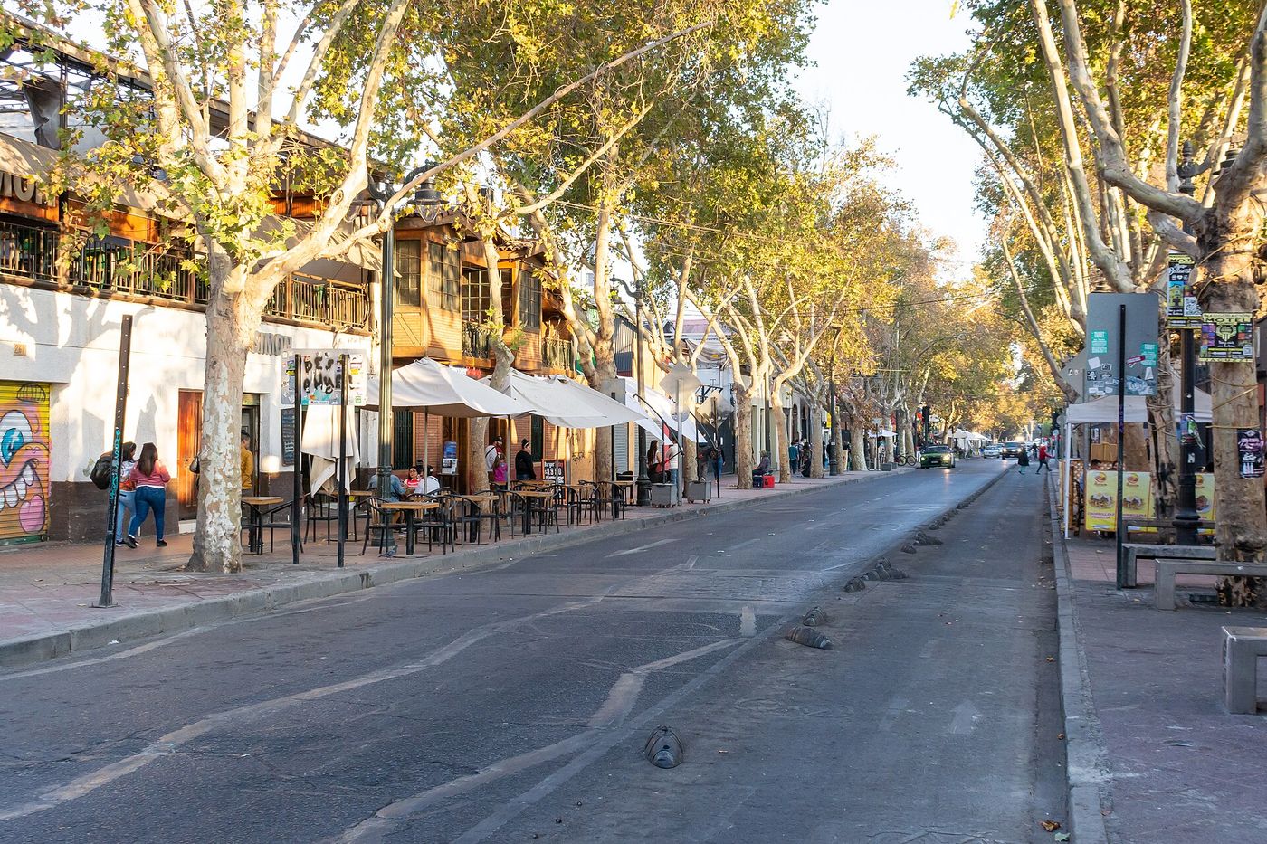 Bars and restaurants with outdoor tables along Calle Pio Nono in the Bellavista district of Santiago