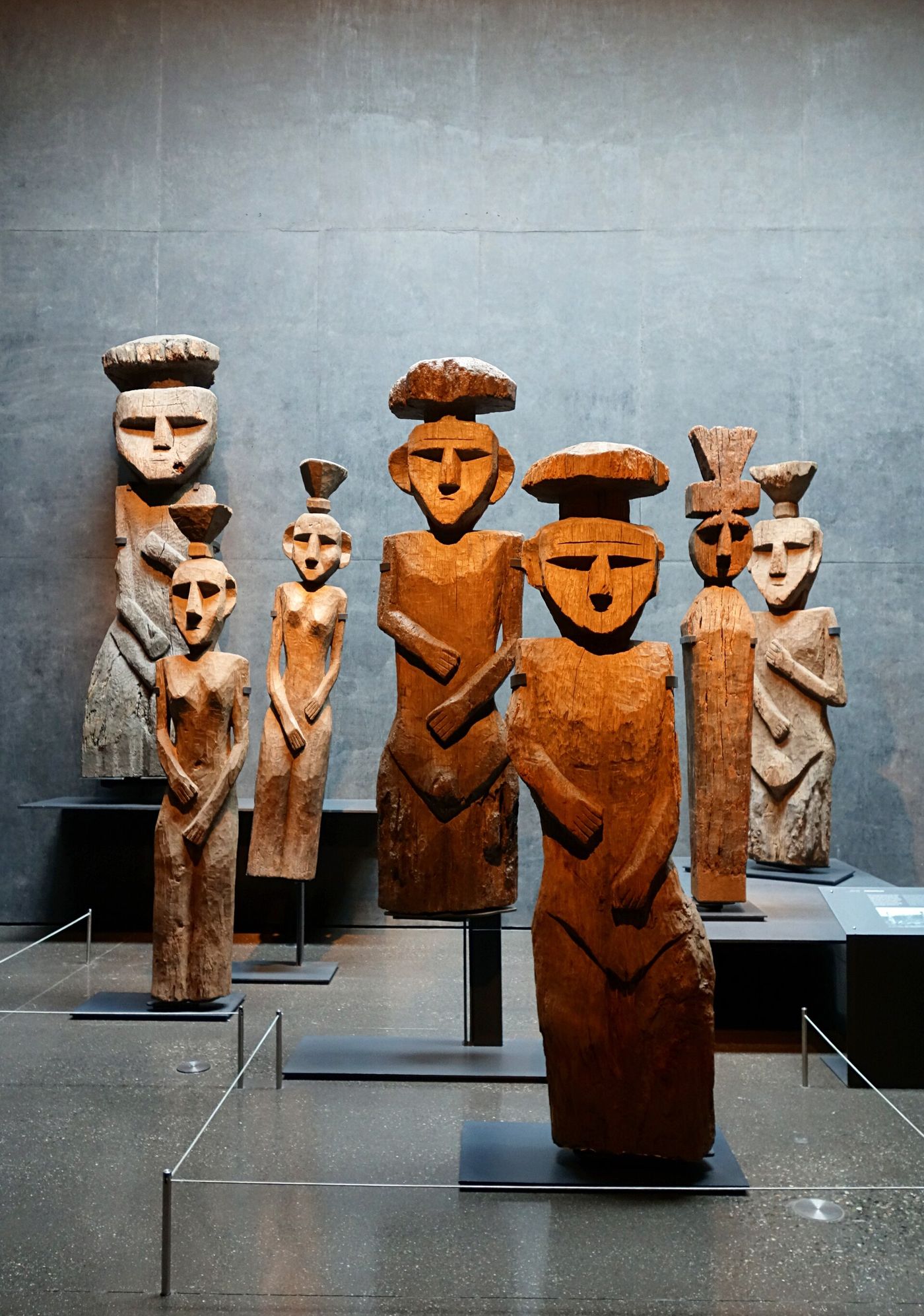 Carved wooden Mapuche chemamull funerary figures on display at the Museo Chileno de Arte Precolombino in Santiago