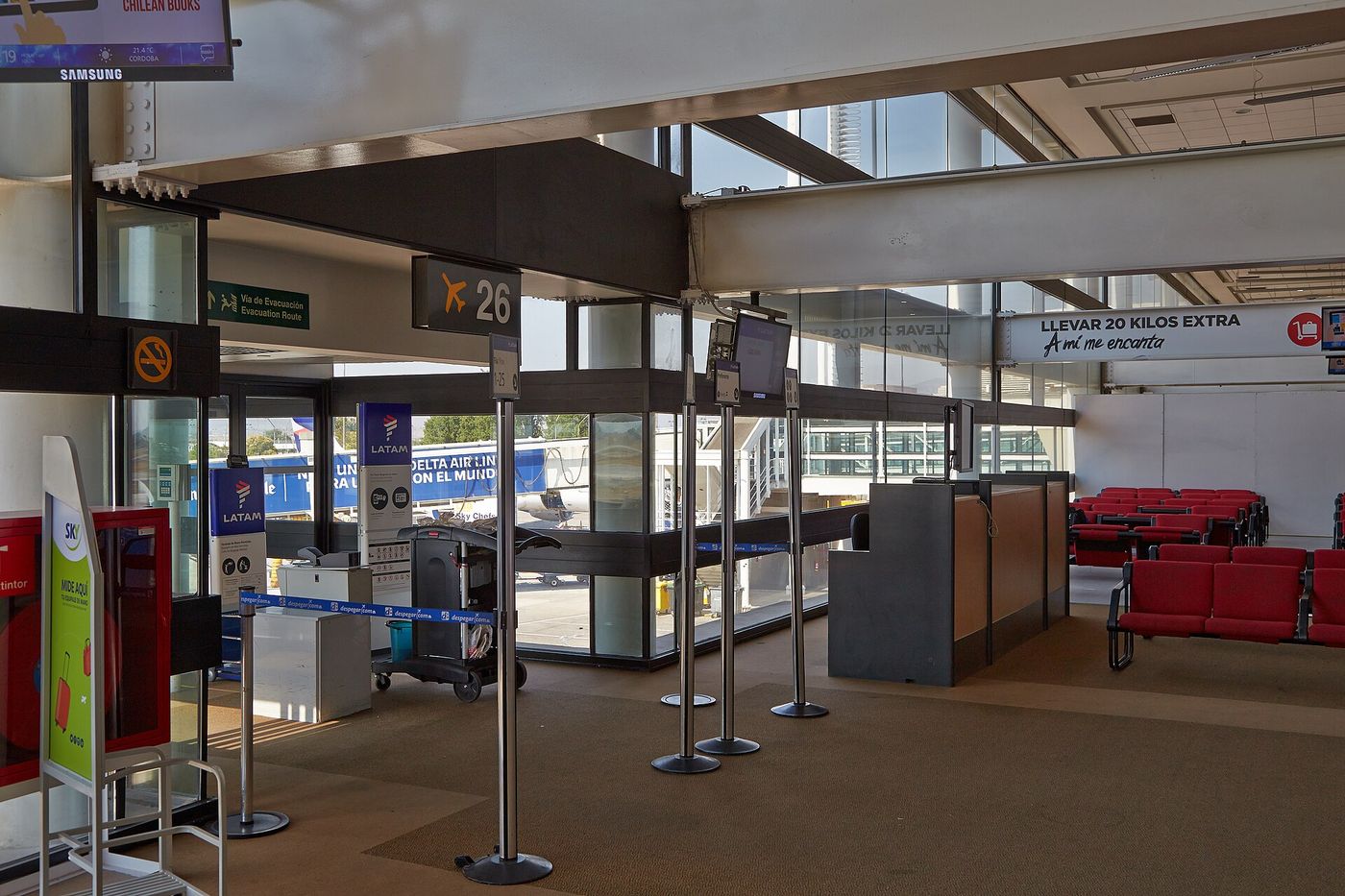 Empty check-in desks and baggage belts at Santiago airport