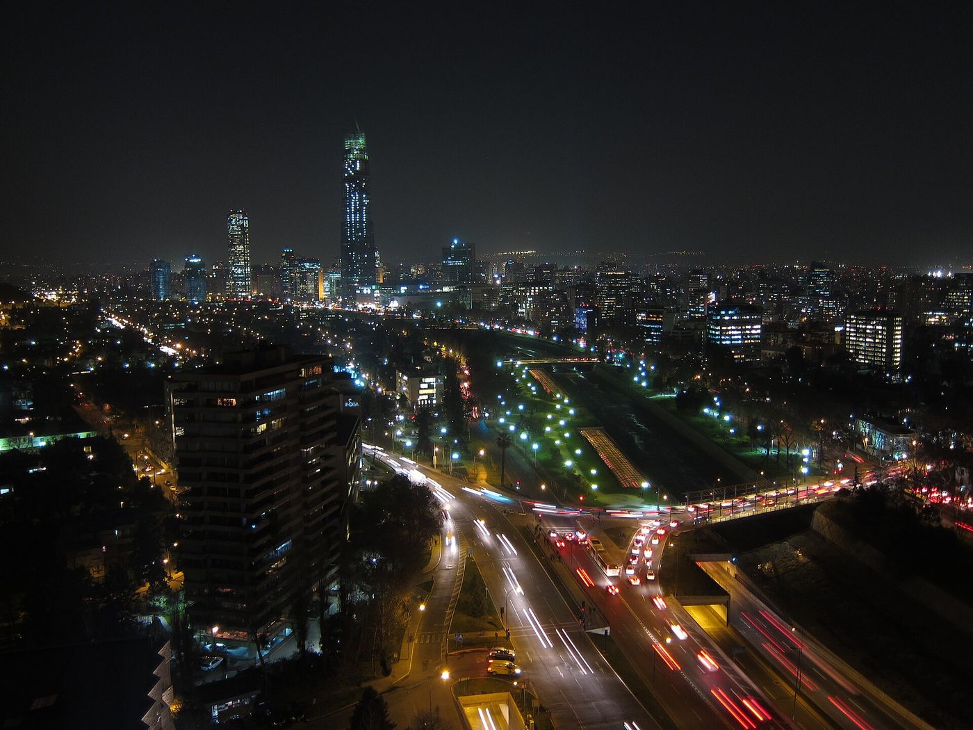 Night view along the Mapocho river and Providencia in Santiago, with traffic trails and lit office towers