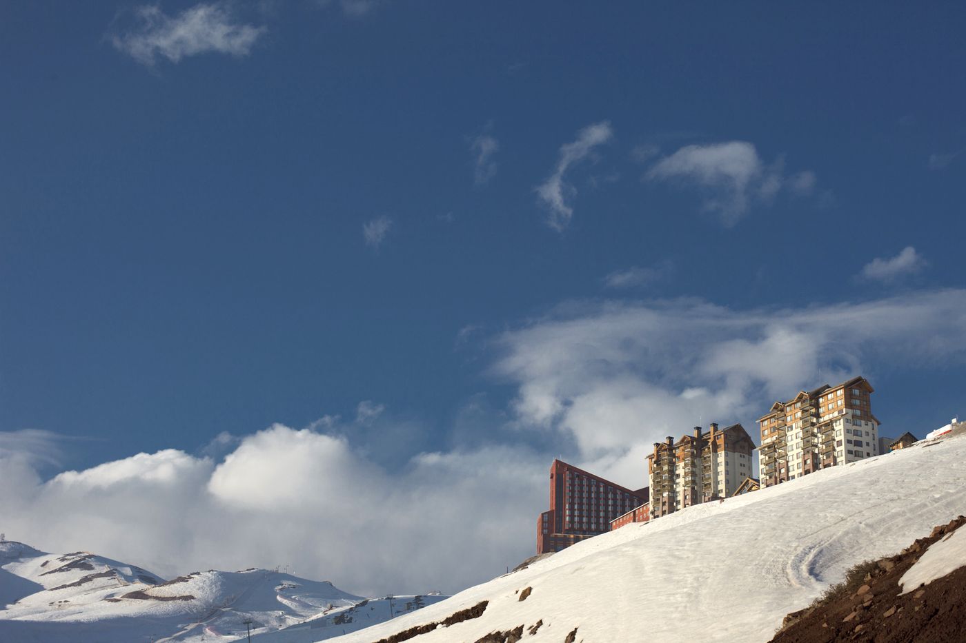 The Valle Nevado ski resort buildings on a snow-covered ridge in the Andes