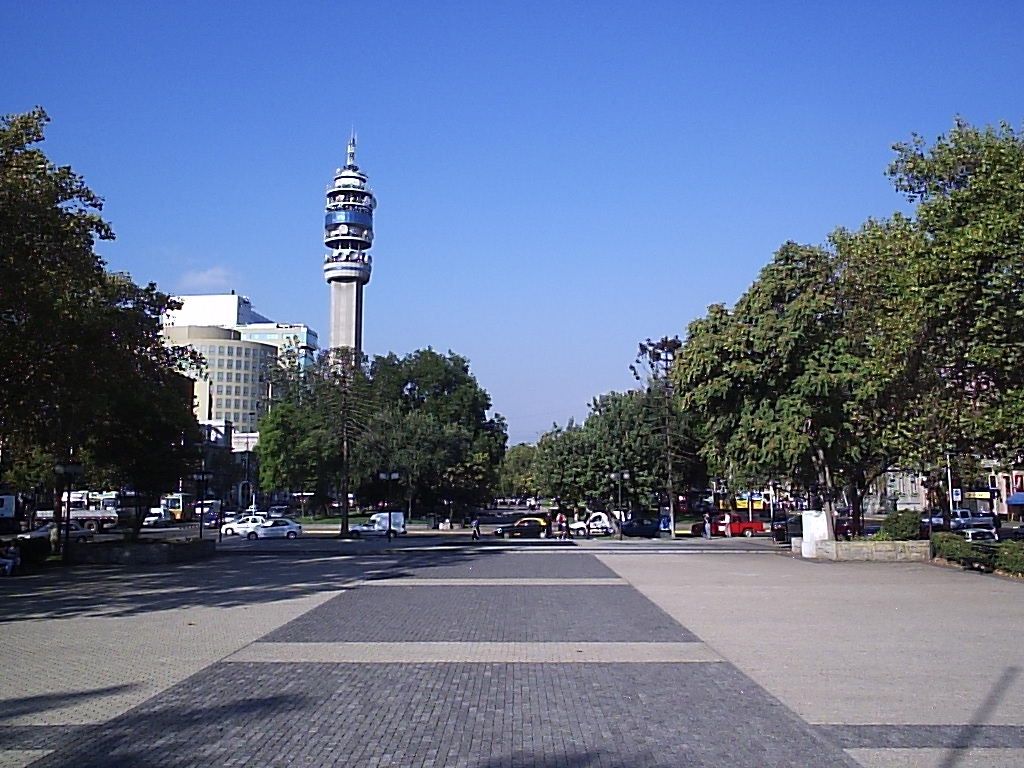 The wide Alameda avenue in central Santiago with trees and the Entel communications tower ahead