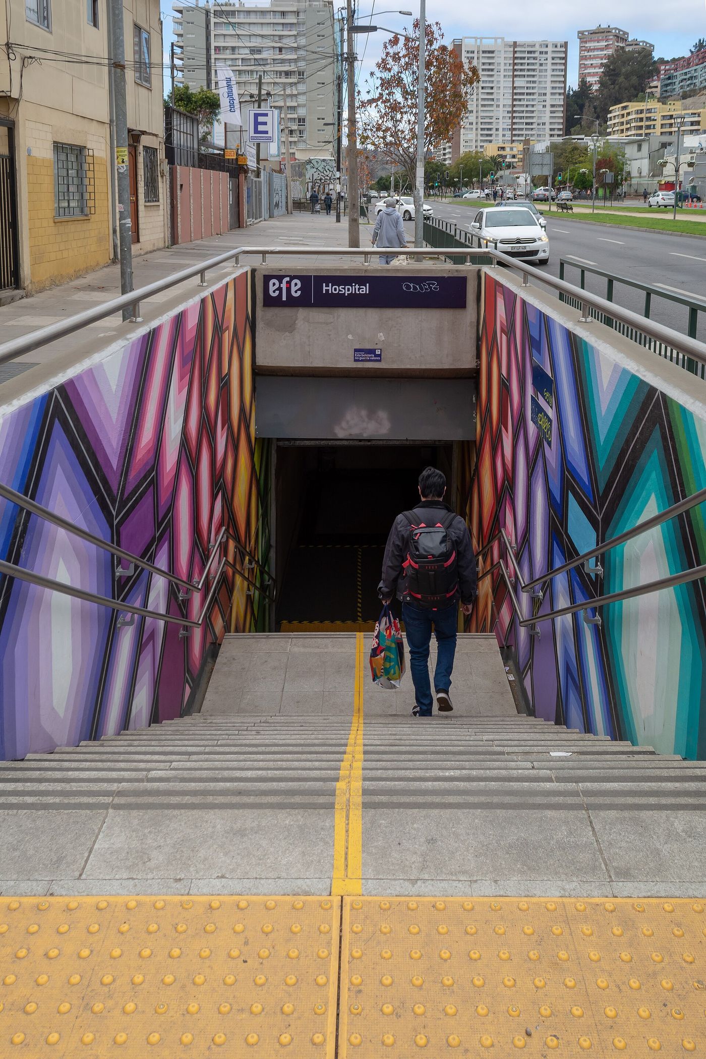 Brightly painted walls framing the stairs down into Hospital station on the Merval line in Viña del Mar